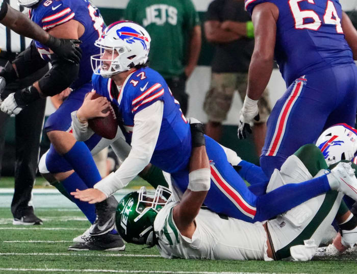 Buffalo Bills quarterback Josh Allen runs with the football against the New York Jets.